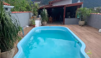 Casa a venda  Morada da Praia - Bertioga - SP: 3 quartos, 2 suítes, piscina e churrasqueira!