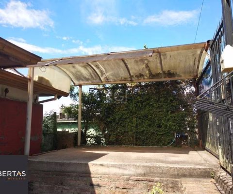 Casa 2 dormitórios, sala, banheiro garagem coberta, terreno 694m² bairro Camaquã