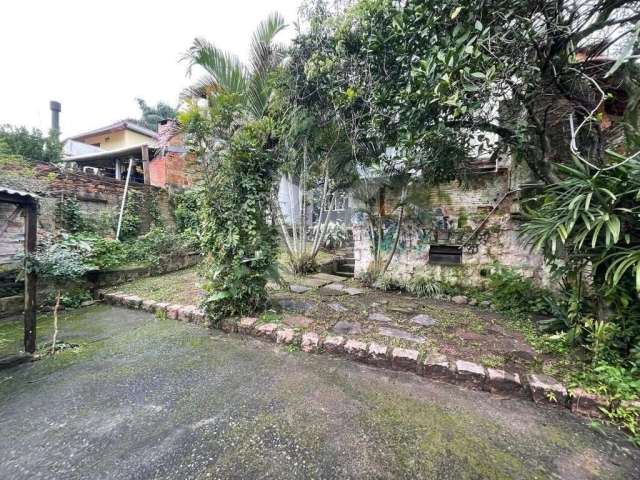 Casa com 4 quartos à venda na Rua Oscar Tollens, 63, Santa Tereza, Porto Alegre por R$ 700.000