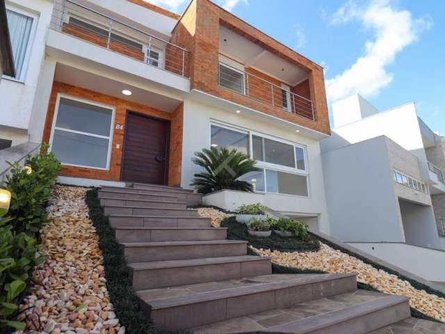 Casa em condomínio fechado com 3 quartos à venda na Rua Francisco Solano Borges, 200, Hípica, Porto Alegre por R$ 1.290.000