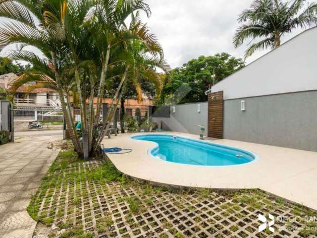 Casa com 4 quartos à venda na Avenida José Gertum, 369, Chácara das Pedras, Porto Alegre por R$ 2.100.000