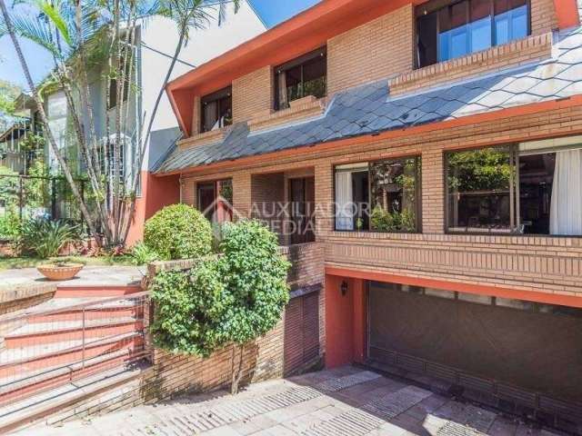 Casa com 4 quartos à venda na Avenida General Barreto Viana, 1024, Chácara das Pedras, Porto Alegre, 336 m2 por R$ 1.699.000