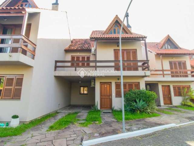 Casa em condomínio fechado com 3 quartos à venda na Avenida Orleaes, 105, Guarujá, Porto Alegre, 196 m2 por R$ 485.000