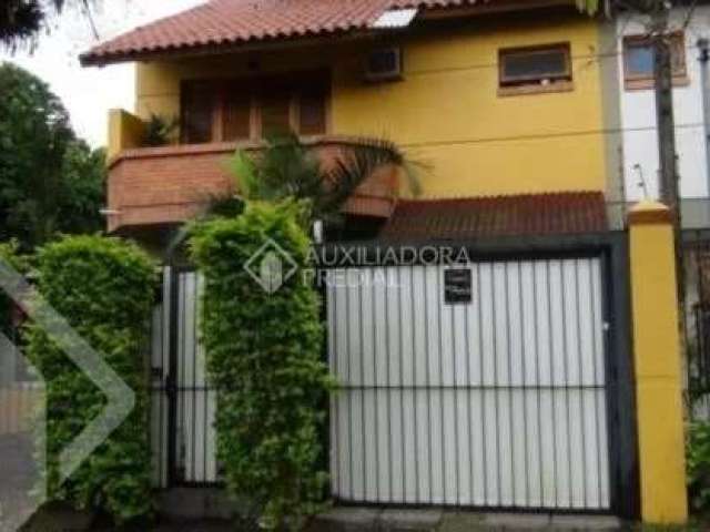 Casa em condomínio fechado com 3 quartos à venda na Rua Mura, 120, Guarujá, Porto Alegre, 154 m2 por R$ 600.000