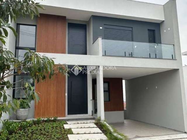 Casa em condomínio fechado com 3 quartos à venda na Avenida Dona Frutuosa, 3, Coronel Nassuca, Guaíba, 173 m2 por R$ 1.649.000