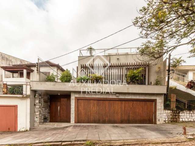 Casa com 4 quartos à venda na Rua Tomaz Edison, 436, Santo Antônio, Porto Alegre, 450 m2 por R$ 1.500.000