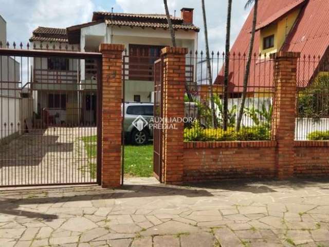 Casa com 7 quartos à venda na Rua General Telino Chagastelles, 75, Parque Santa Fé, Porto Alegre, 270 m2 por R$ 599.900