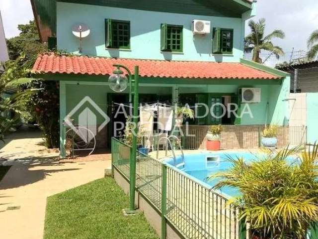 Casa em condomínio fechado com 4 quartos à venda na Rua Mura, 50, Guarujá, Porto Alegre, 297 m2 por R$ 690.000