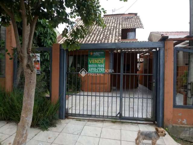 Casa com 3 quartos à venda na Rua Corujas, 635, Jardim Algarve, Alvorada, 120 m2 por R$ 400.000