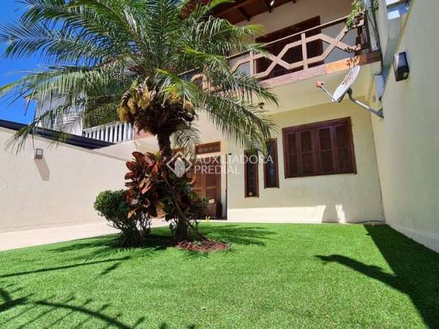 Casa com 3 quartos à venda na Rua Dos Quero Queros, 576, Jardim Algarve, Alvorada, 170 m2 por R$ 790.000