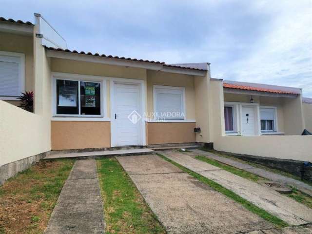 Casa em condomínio fechado com 2 quartos à venda na Rua Oscar Schick, 2350, Formoza, Alvorada, 66 m2 por R$ 254.300