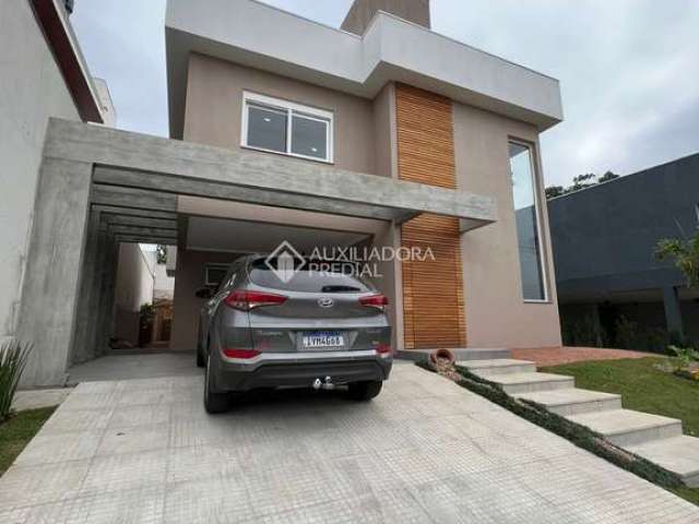 Casa em condomínio fechado com 3 quartos à venda na Avenida Senador Salgado Filho, 8500, Querência, Viamão, 399 m2 por R$ 1.390.000