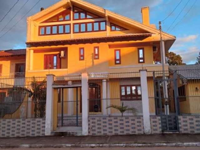 Casa com 4 quartos à venda na Avenida Vasco Alves Pereira, 6, Morada da Colina, Guaíba, 106 m2 por R$ 980.000