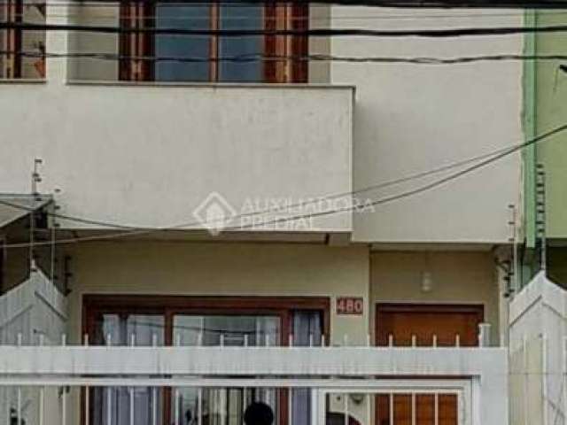 Casa em condomínio fechado com 3 quartos à venda na Rua Heitor Kramer, 480, Guarujá, Porto Alegre, 129 m2 por R$ 460.000