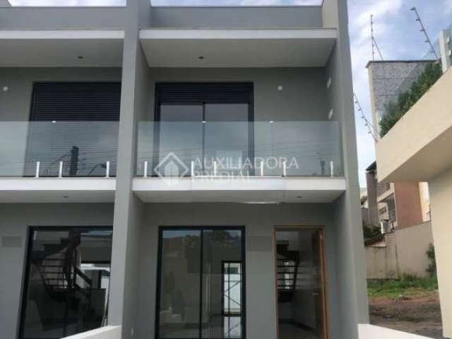 Casa em condomínio fechado com 2 quartos à venda na Rua Heitor Kramer, 704, Guarujá, Porto Alegre, 100 m2 por R$ 475.000