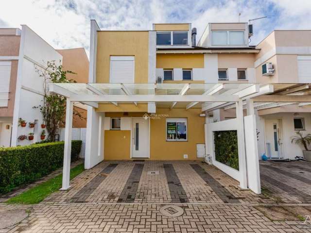 Casa em condomínio fechado com 3 quartos à venda na Avenida Açucena, 550, Estância Velha, Canoas, 190 m2 por R$ 930.000