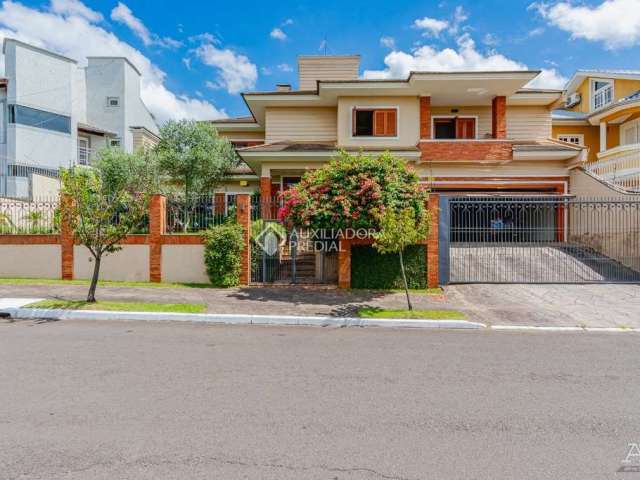 Casa com 4 quartos à venda na Rua País de Gales, 245, Marechal Rondon, Canoas, 600 m2 por R$ 2.544.000