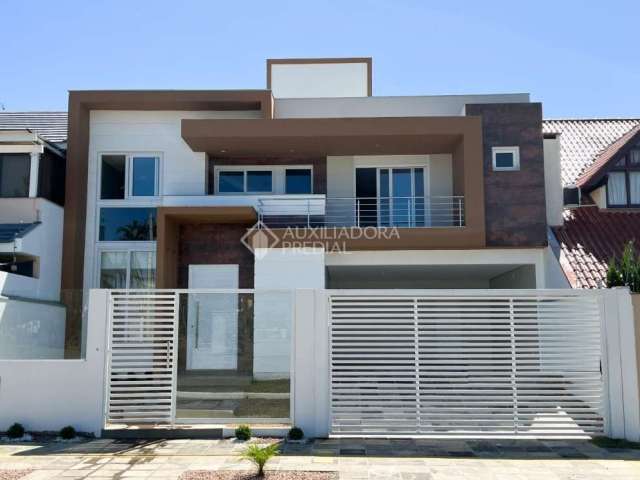 Casa em condomínio fechado com 3 quartos à venda na Rua Áustria, 38, Marechal Rondon, Canoas, 229 m2 por R$ 1.800.000