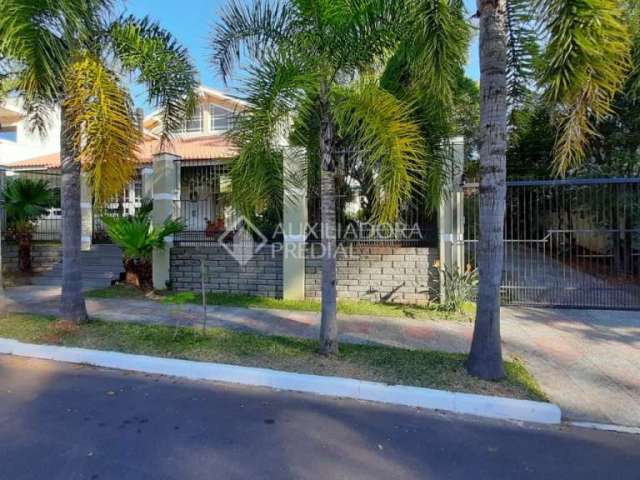 Casa em condomínio fechado com 5 quartos à venda na Rua País de Gales, 41, Marechal Rondon, Canoas, 333 m2 por R$ 2.500.000