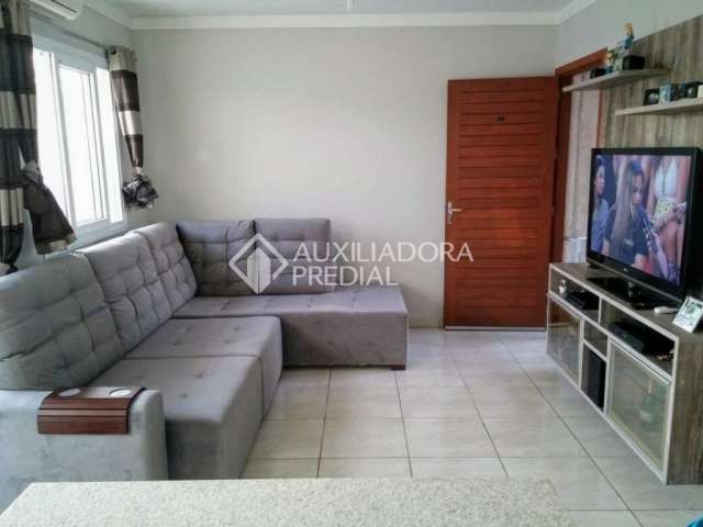 Casa em condomínio fechado com 2 quartos à venda na Avenida do Nazario, 2111, Olaria, Canoas, 109 m2 por R$ 300.000