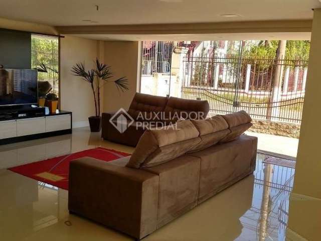 Casa em condomínio fechado com 4 quartos à venda na Rua Gabriel Miro, 230, Marechal Rondon, Canoas, 370 m2 por R$ 1.920.000