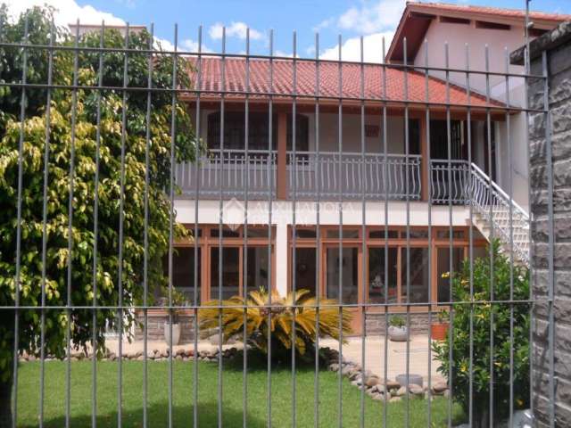 Casa com 4 quartos à venda na Avenida Farroupilha, 6251, Marechal Rondon, Canoas, 240 m2 por R$ 1.170.000