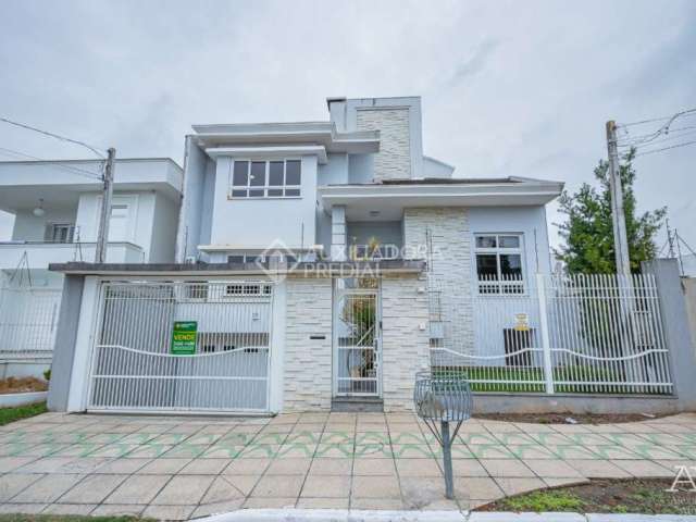 Casa com 4 quartos à venda na Rua País de Gales, 137, Marechal Rondon, Canoas, 359 m2 por R$ 1.599.000