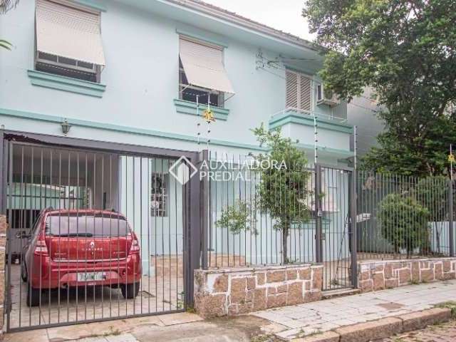 Casa em condomínio fechado com 4 quartos à venda na Rua Xavier Ferreira, 113, Auxiliadora, Porto Alegre, 230 m2 por R$ 900.000