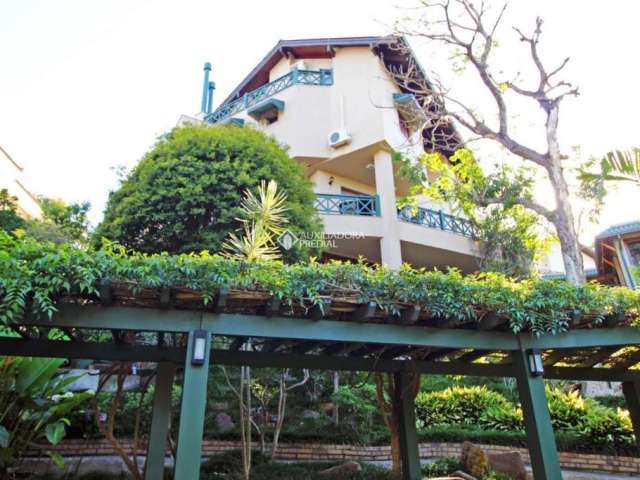 Casa em condomínio fechado com 6 quartos à venda na Avenida da Cavalhada, 5205, Cavalhada, Porto Alegre, 888 m2 por R$ 3.830.000