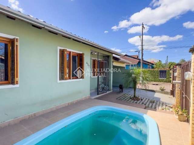 Casa com 3 quartos à venda na Rua Corujas, 437, Jardim Algarve, Alvorada, 120 m2 por R$ 320.000