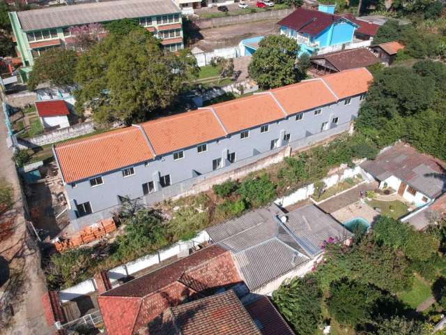 Casa em condomínio fechado com 2 quartos à venda na Rua Sebastião Wolf, 197, Nonoai, Porto Alegre, 70 m2 por R$ 360.899