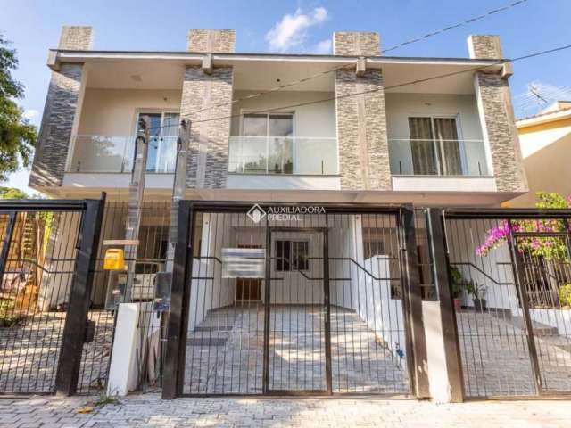 Casa com 3 quartos à venda na Rua Abdo Jorge Curi, 235, Parque Santa Fé, Porto Alegre, 143 m2 por R$ 499.000