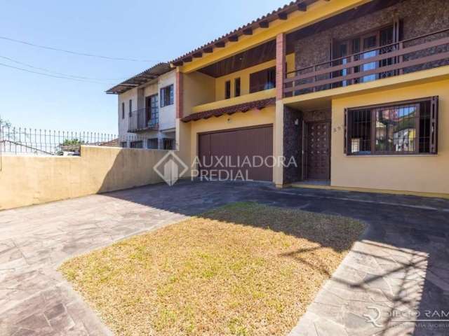 Casa em condomínio fechado com 3 quartos à venda na Avenida Ipê, 298, Vila Jardim, Porto Alegre, 192 m2 por R$ 900.000