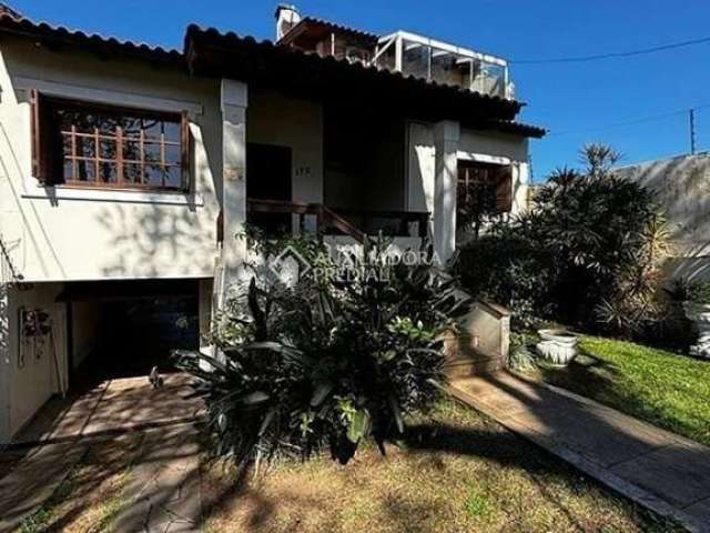 Casa em condomínio fechado com 4 quartos para alugar na Rua Butuí, 173, Cristal, Porto Alegre, 376 m2 por R$ 8.000