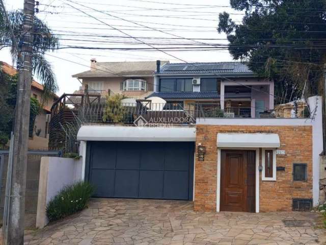 Casa em condomínio fechado com 3 quartos à venda na Rua Charruas, 257, Espírito Santo, Porto Alegre, 390 m2 por R$ 2.200.000