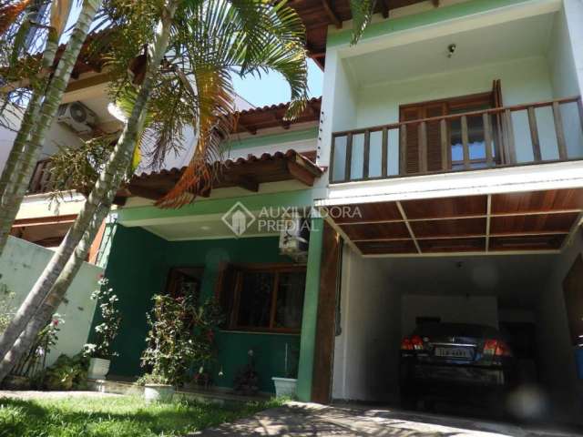 Casa em condomínio fechado com 3 quartos à venda na Rua Márcio Dias, 176, Nonoai, Porto Alegre, 317 m2 por R$ 780.800