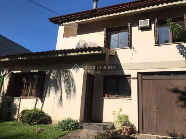 Casa em condomínio fechado com 5 quartos à venda na Praça São Caetano, 90, Teresópolis, Porto Alegre, 195 m2 por R$ 1.200.000