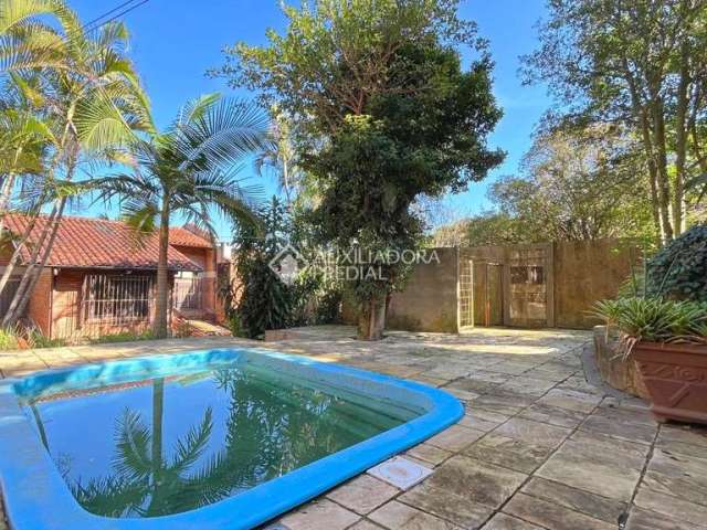 Casa com 3 quartos à venda na Rua Edgar Luiz Schneider, 490, Jardim Isabel, Porto Alegre, 350 m2 por R$ 1.290.000