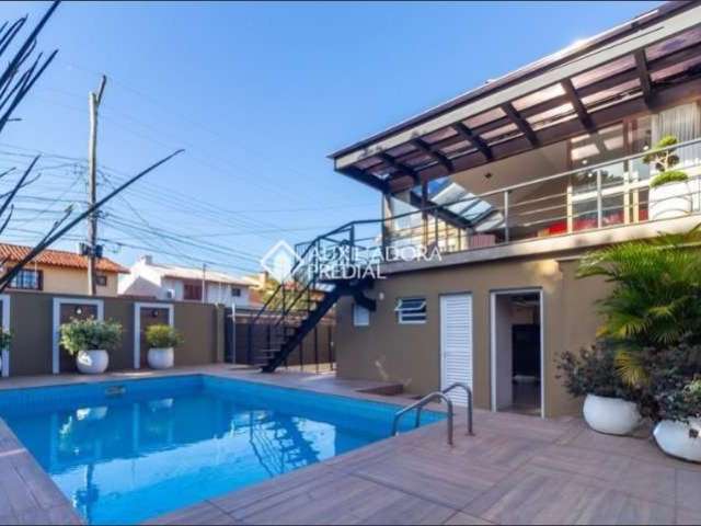 Casa com 4 quartos à venda na Rua Criciúma, 115, Guarujá, Porto Alegre, 288 m2 por R$ 1.500.000