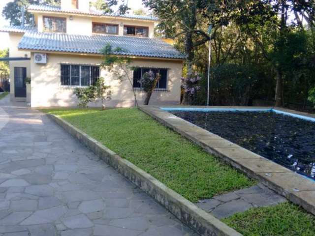 Casa em condomínio fechado com 3 quartos à venda na Rua Doutor Cecílio Monza, 10662, Belém Novo, Porto Alegre, 476 m2 por R$ 1.350.000