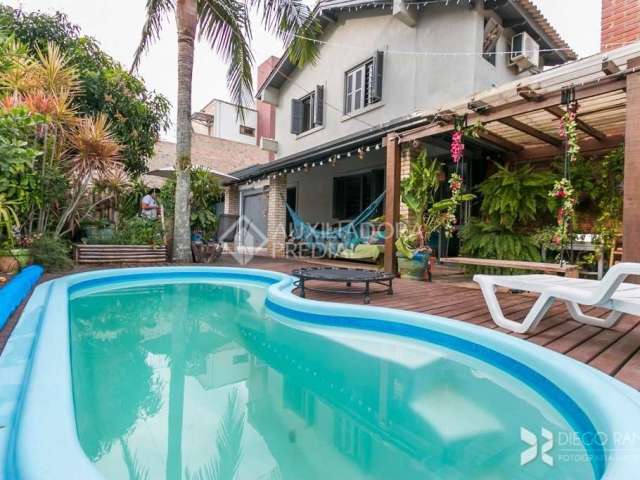 Casa em condomínio fechado com 3 quartos à venda na Estrada João Passuelo, 1060, Vila Nova, Porto Alegre, 230 m2 por R$ 520.000