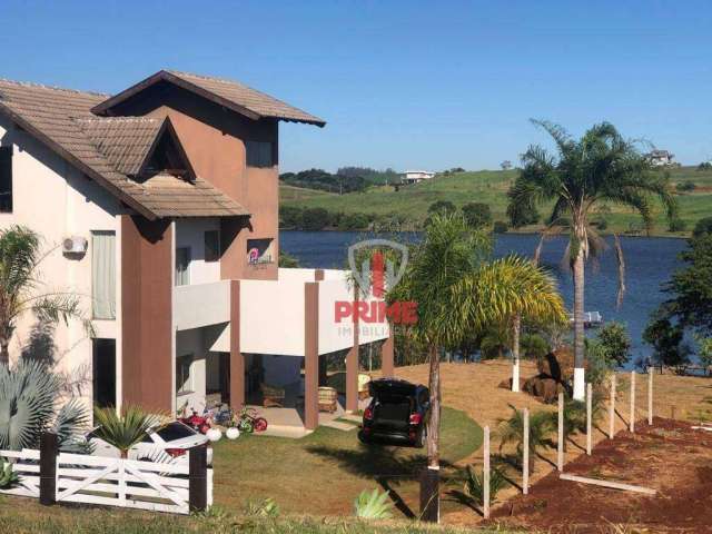 Sobrado para venda e locação no condomínio Ecovillas do Lago em Londrina. Com 5 suítes, 2 salas, hall de entrada, lavabo, copa, cozinha, área de servi