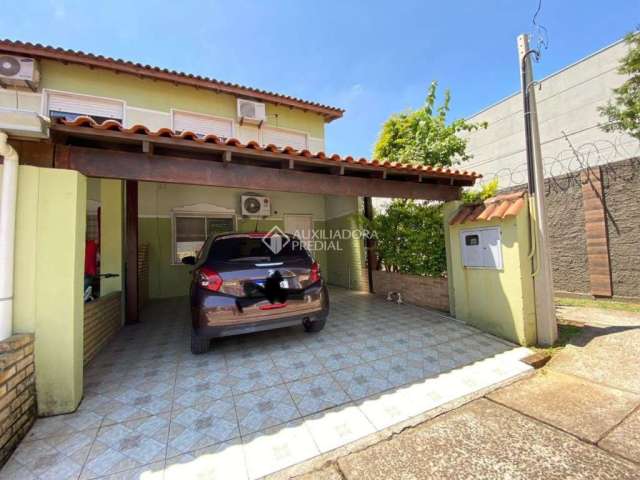 Casa em condomínio fechado com 3 quartos à venda na Rua Henrique Stefani, 801, Igara, Canoas, 88 m2 por R$ 320.000