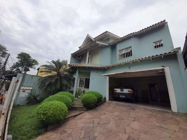 Casa com 3 quartos à venda na Rua da Amizade, 92, Estância Velha, Canoas, 197 m2 por R$ 745.000