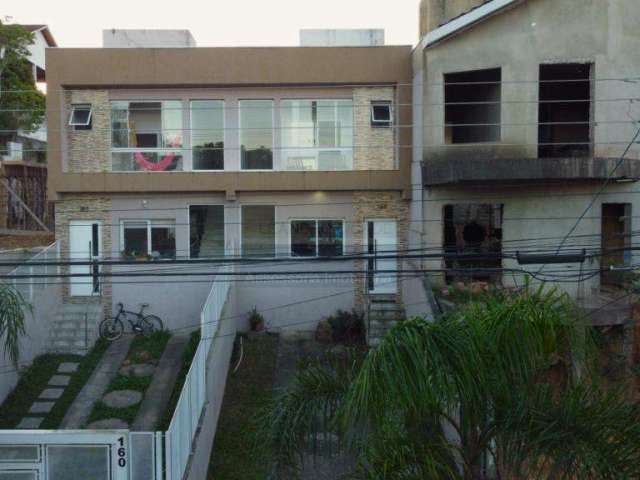 Casa de condomínio 3 dormitórios à venda no Bairro Mário Quintana com 110 m² de área privativa - 2 vagas de garagem