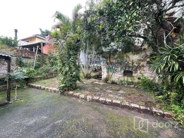 Casa com 4 quartos à venda na Rua Oscar Tollens, 63, Santa Tereza, Porto Alegre, 280 m2 por R$ 700.000