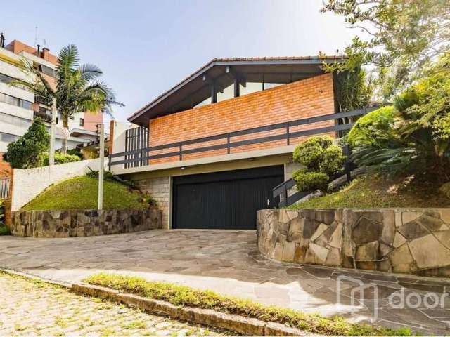 Casa com 4 quartos à venda na Travessa Java, 76, Jardim Lindóia, Porto Alegre, 399 m2 por R$ 1.095.000