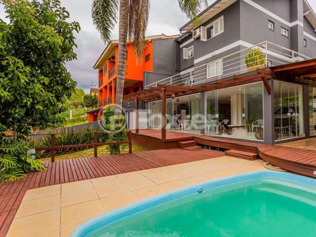 Casa em condomínio fechado com 3 quartos à venda na Rua Peroba, 131, São Lucas, Viamão, 403 m2 por R$ 1.100.000