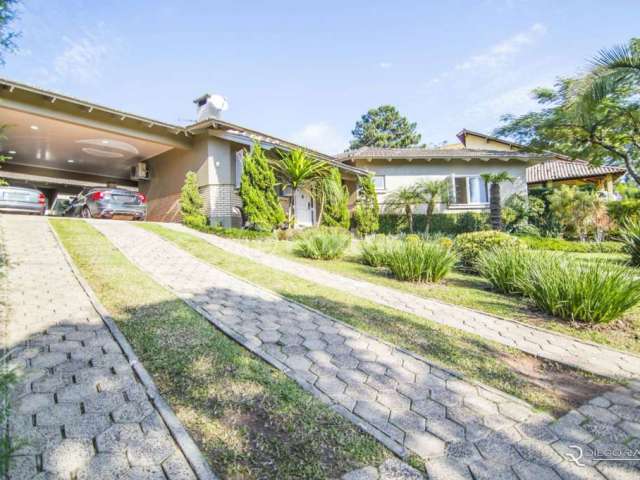 Casa em condomínio fechado com 3 quartos à venda na Estrada Capitão Gentil Machado de Godoy, 4500, Vila Elsa, Viamão, 280 m2 por R$ 1.050.000