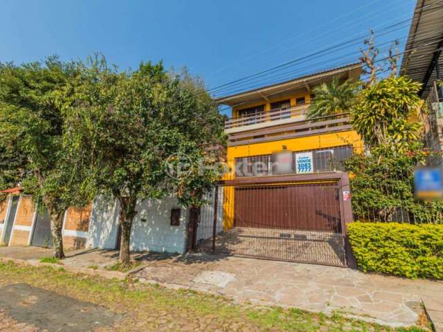 Casa com 3 quartos à venda na Rua Coronel Ruy da Cunha Paim, 35, Nonoai, Porto Alegre, 294 m2 por R$ 899.000